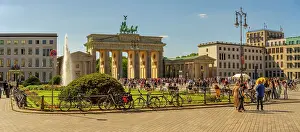 Water Fountain Prints: View of Brandenburg Gate and visitors in Pariser Platz on sunny day