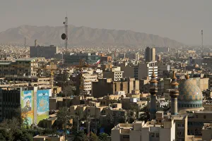 Domes Gallery: View over buildings from city centre towards Alborz Mountains, Tehran, Iran, Middle East