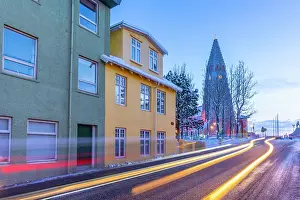 Nordic Prints: View of buildings in the city centre and Hallgrimskirkja church at dusk in winter
