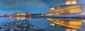 Cultural Landmark Prints: View of buildings and Oslo Opera House reflecting in harbour at dusk