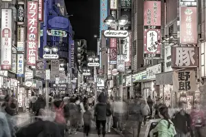 Pedestrians Prints: View of busy street and neon lights at night in Shibuya District