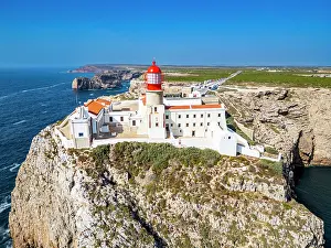 Safety Prints: View from above of Cabo de Sao Vicente lighthouse on a cliff near the ocean in Sagres