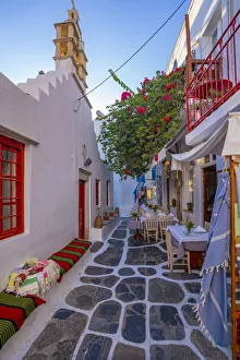Mykonos Prints: View of cafe in colourful narrow cobbled street, Mykonos Town, Mykonos, Cyclades Islands