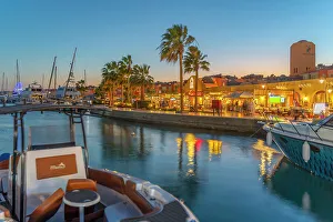 Seacoast Prints: View of cafe and restaurant in Hurghada Marina at dusk