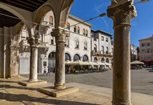 View of cafes from arches of the Town Hall in Forum Square, Pula, Istria County, Croatia