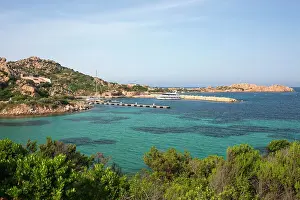 Crystal Clear Prints: View over calm turquoise water to Porto Massimo and the rocky headland of Punta Lunga