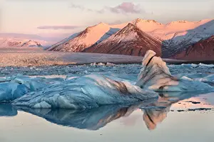 South Iceland Prints: View across the calm water of Jokulsarlon glacial lagoon towards snow-capped mountains