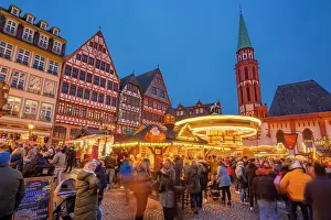 Hesse Prints: View of carousel and Christmas Market on Roemerberg Square at dusk