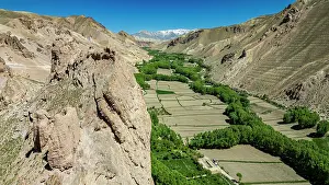 Afghanistan Prints: View of castle Gorgaheen overlooking the valley in Bamiyan province with fields and mountains in the background