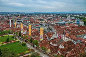 Streets Prints: View from Castle hill overlooking the UNESCO heritage area of Graz in Austria with colorful rooftops and banners