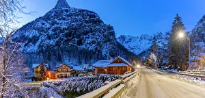 Courmayeur Prints: View of chalets and snow covered mountains in Courmayeur at dusk in winter