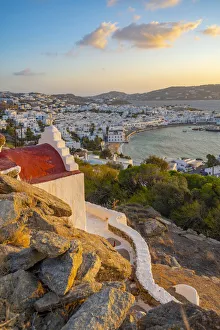 Mykonos Prints: View of chapel and town from elevated view point at sunset, Mykonos Town, Mykonos