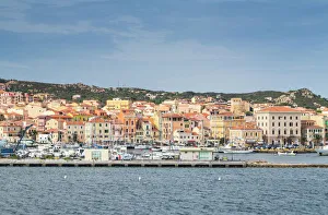 Pier Gallery: View of the characteristic harbour and blue sea of Caprera, La Maddalena Island, Sardinia