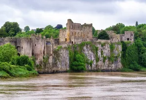 Riverside Prints: View of Chepstow Castle from the north bank of the River Wye in Monmouthshire Wales during overcast weather