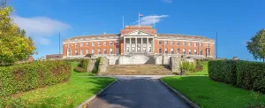 Walkway Prints: View of Chesterfield Town Hall in autumn with trees and walking path in Derbyshire