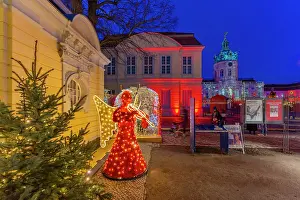 Angel Prints: View of Christmas market at Charlottenburg Palace in Schloss Charlottenburg at dusk