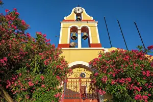 Bells Prints: View of church bell tower overlooking Fiscardo harbour