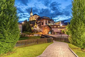 Salzburg Prints: View of church at dusk with trees and path in Kaprun during summer
