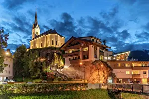 Bell Prints: View of church in Kaprun at dusk with buildings on hillside and clear sky in summer evening in Austria