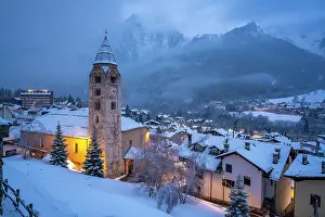 Décor Prints: View of Church of Saint Pantalon and the snow covered town centre and mountainous background in winter