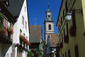 View to church tower and timbered houses, Riquewihr, Haute-Rhin, Alsace, France, Europe