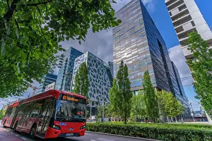 Public Spaces Prints: View of city bus and contemporary architecture in the Barcode area on a sunny day