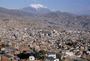 Volcano Prints: View across city from El Alto, with Illimani volcano in distance, La Paz