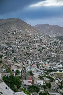 Settlement Prints: View of the city of Kabul from a high point showing buildings and mountains under a cloudy sky