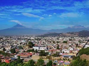 Volcanoes Prints: View over the city towards Popocatepetl and Iztaccihuatl Volcanoes