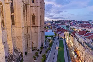Adventures Prints: View of city rooftops and Carmo Archaeological Museum from Santa Justa Lift at sunset