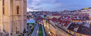 Vantage Prints: View of city rooftops and Carmo Archaeological Museum from Santa Justa Lift at sunset