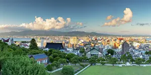 Spaces Prints: View of the city skyline and landscape from Motomachi in Hakodate, Japan during sunset