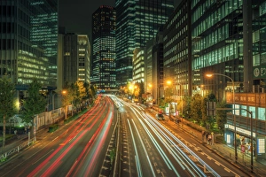 Pedestrians Prints: View of city street and trail lights at night, Minato City, Tokyo, Honshu, Japan