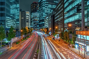 Pedestrians Prints: View of city street and trail lights at night, Minato City, Tokyo, Honshu, Japan