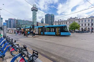 Public Space Prints: View of city tram and Ruter Help Center in Jernbanetorget