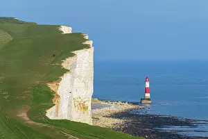 Lighthouses Prints: View of the coast of the Seven Sisters white chalk cliffs with the Beachy Head lighthouse in the background