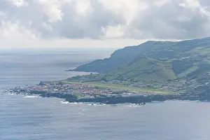 Azores Prints: View of the coastline and greenery of Santa Cruz das Flores in the Azores islands of Portugal from above