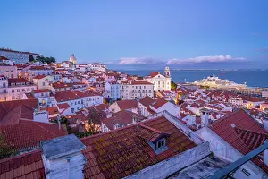 Alfama Prints: View of colourful buildings and red rooftops at dusk in the Alfama District