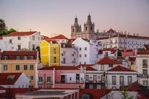 Alfama Prints: View of colourful buildings and red rooftops at sunset in the Alfama District