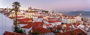Alfama Prints: View of colourful buildings and red rooftops at sunset in the Alfama District