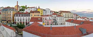 Alfama Prints: View of colourful buildings and red rooftops at sunset in the Alfama District