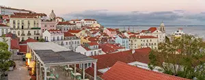 Alfama Prints: View of colourful buildings and red rooftops at sunset in the Alfama District