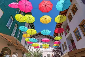 Umbrellas Prints: View of colourful umbrellas in Zell am See on a sunny day