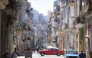 Crowded Prints: View along congested street in Havana Centro showing people walking along pavements