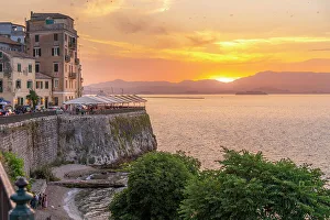Outdoor Dining Prints: View of Corfu Town and Ionian Sea during golden hour