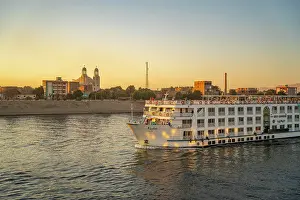 Cruise Prints: View of cruise boats from cruise boat near Esna on the Nile River at sunset