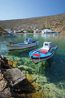 Typically Greek Gallery: View over crystal clear water and fishing boats in harbour, Cheronissos, Sifnos, Cyclades
