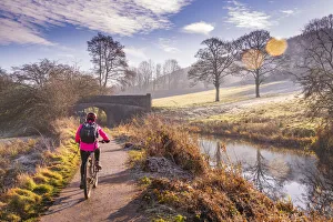 Cycling Prints: View of cyclist and frosty morning at the Cromford Canal