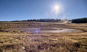 Fence Prints: View of Deer Lake Sinkhole at sunset on Kaibab Plateau with wooden fence to protect cattle