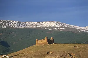 Sierra Nevada Prints: View to distant medieval castle beneath the snow-capped Sierra Nevada